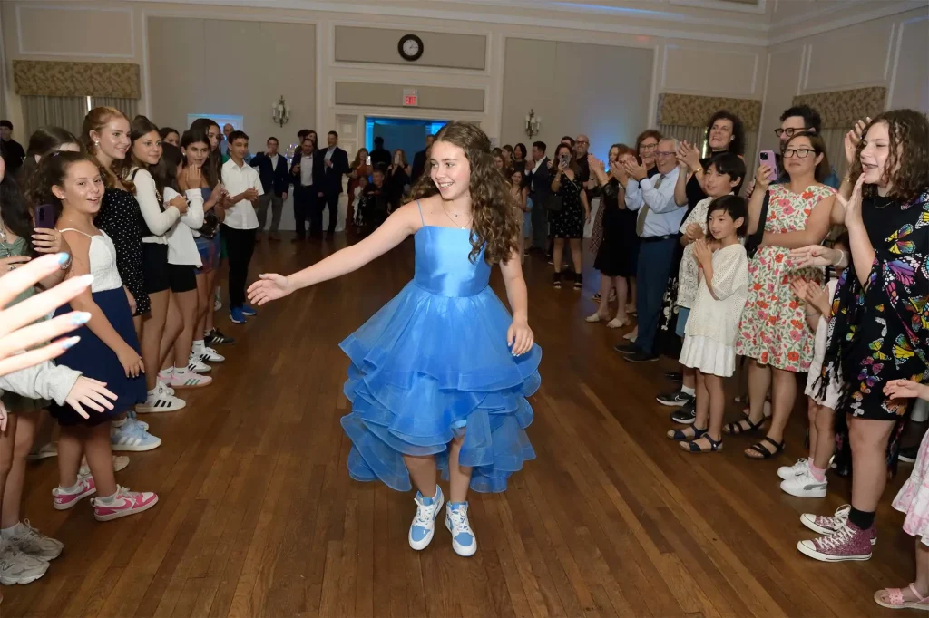 image of teen girl in blue dress at bat mitzvah